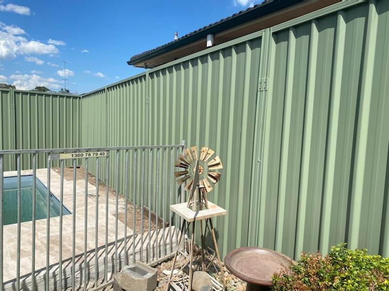 Colorbond fence extension beside a Sydney pool