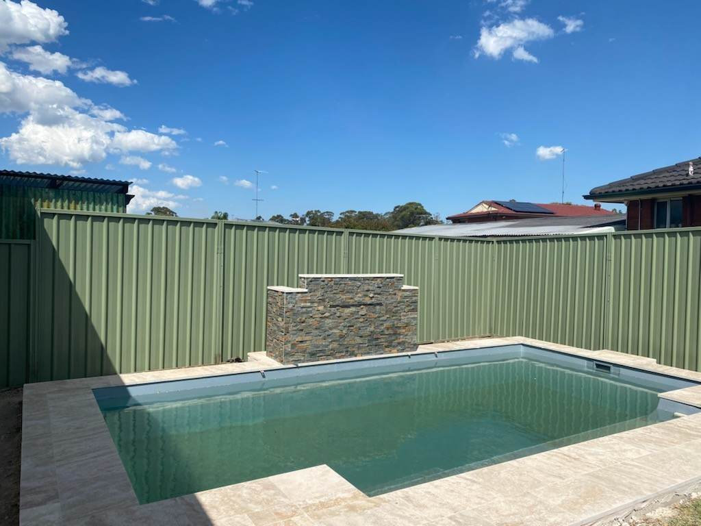 Colorbond fence extension beside a Sydney pool