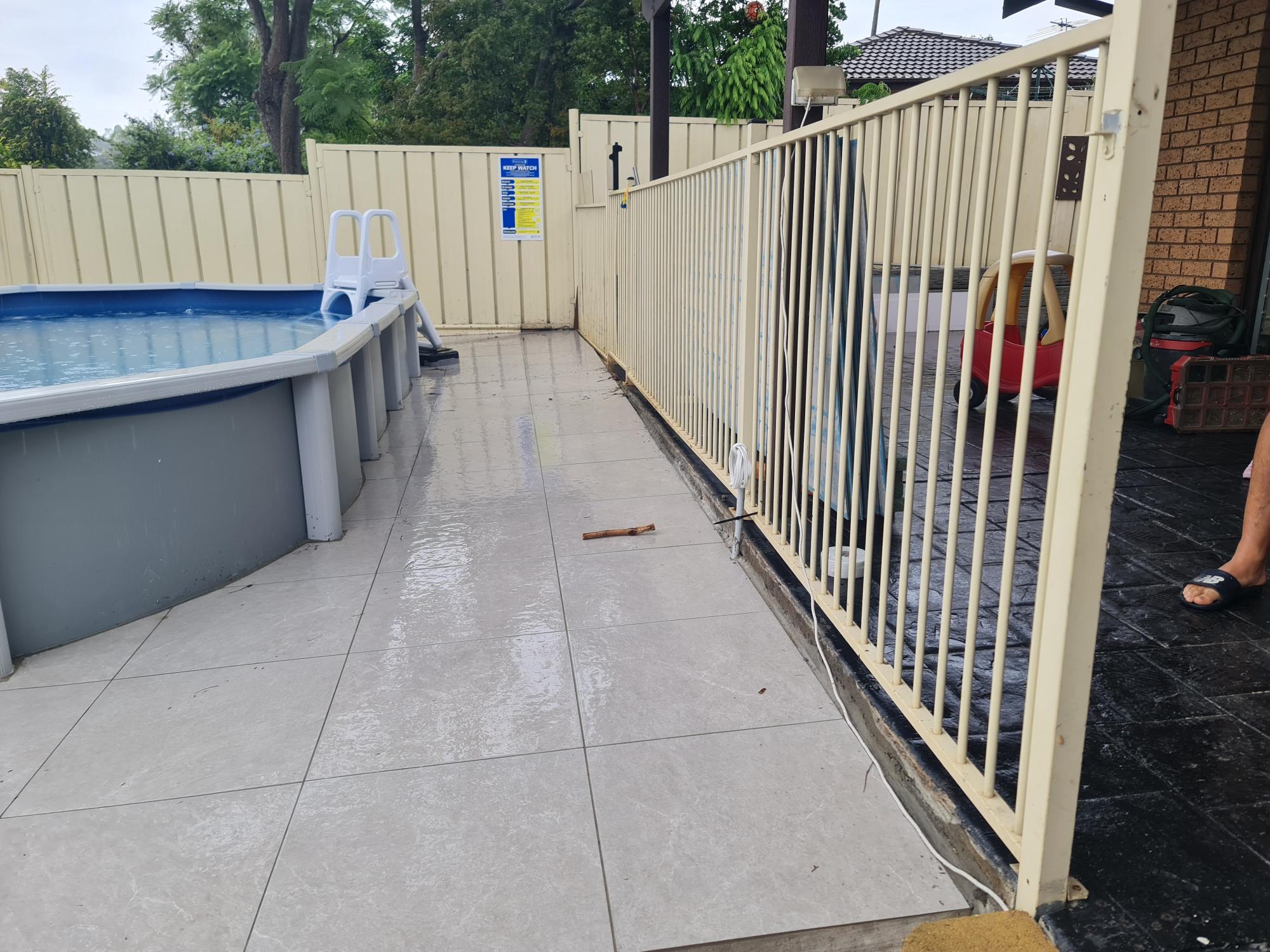 Colorbond fence extension beside a Sydney pool