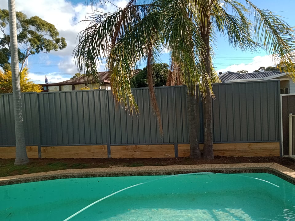 Colorbond fence extension beside a Sydney pool